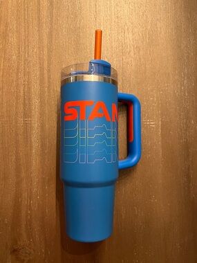 Stanley Blue Travel Tumbler with Orange Accents and Handle